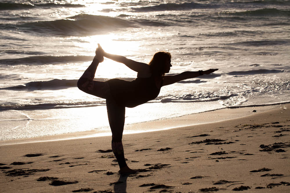 Early Morning Yoga On The Beach